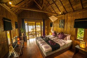 Voodi või voodid majutusasutuse Lazy Days Bungalows toas
