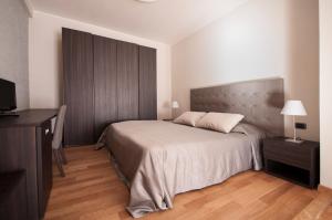 Voodi või voodid majutusasutuse Hotel Maloia toas