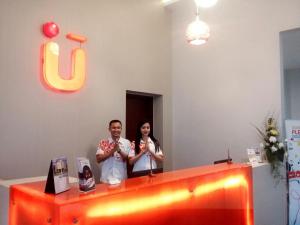 a man and a woman standing behind a counter at Urban Style by Front One in Margakaya