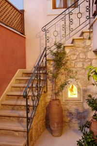 a staircase with a vase with a plant in it at Casa dell' Aristea in Atsipopoulo