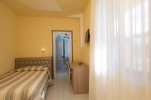Postel nebo postele na pokoji v ubytování Hotel Gemma Del Mare