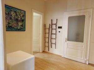 a room with a ladder and a painting on the wall at Inappartamento La Pepita Luxury in Turin +38 photos