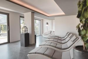 Hotel Tiefenbrunn Gardensuites & Breakfast的休息区