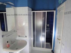 a bathroom with a sink and a shower at L'ulivo Chiantigiana 115 in Florence +23 photos