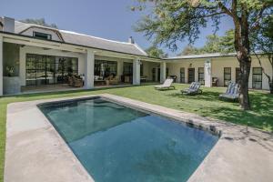 a swimming pool in the backyard of a house at The Whyte House in Graaff-Reinet