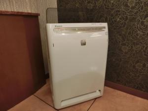a small white refrigerator sitting in a room at Hotel Hyper Noah (Adult Only) in Sakai