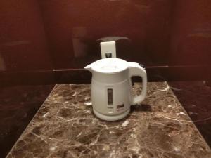 a coffee maker sitting on a counter in a bathroom at Hotel Hyper Noah (Adult Only) in Sakai
