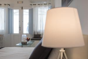 A bed or beds in a room at Dreaming View Suites