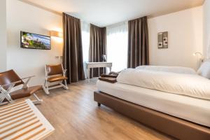Voodi või voodid majutusasutuse Hotel Paradiso toas
