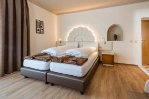 Voodi või voodid majutusasutuse Hotel Paradiso toas