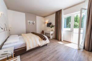Voodi või voodid majutusasutuse Hotel Paradiso toas