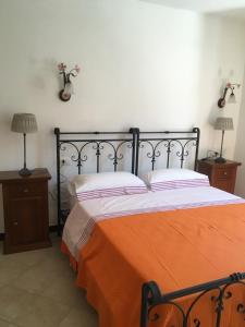 Postel nebo postele na pokoji v ubytování Agriturismo La Ferriera