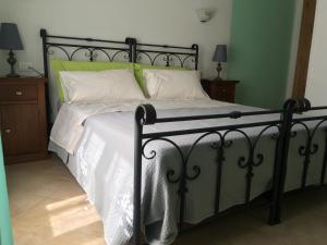Postel nebo postele na pokoji v ubytování Agriturismo La Ferriera