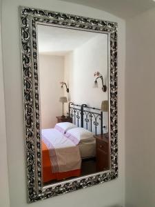 Postel nebo postele na pokoji v ubytování Agriturismo La Ferriera