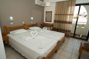 Postel nebo postele na pokoji v ubytování International Hotel