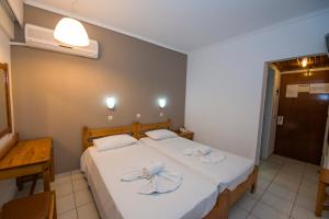 Postel nebo postele na pokoji v ubytování International Hotel