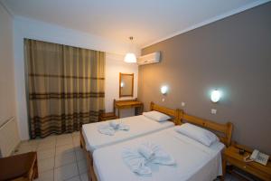 Postel nebo postele na pokoji v ubytování International Hotel