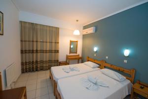 Postel nebo postele na pokoji v ubytování International Hotel