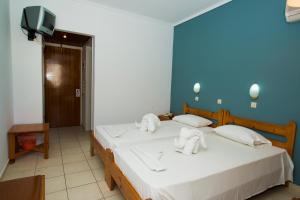 Postel nebo postele na pokoji v ubytování International Hotel