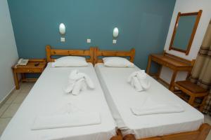 Postel nebo postele na pokoji v ubytování International Hotel