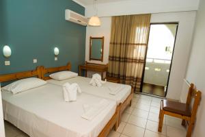 Postel nebo postele na pokoji v ubytování International Hotel