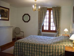 Posteľ alebo postele v izbe v ubytovaní Aux Trois Damoiselles