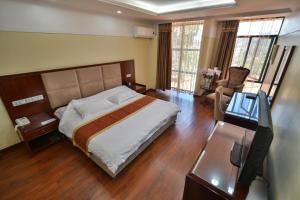 Postel nebo postele na pokoji v ubytování Arirang Hotel