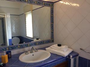 a bathroom with a sink and a mirror at Etna View Affittacamere in Giardini Naxos +21 photos
