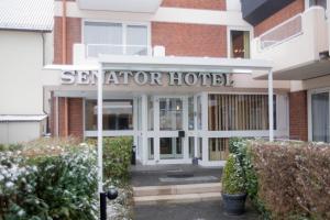 a building with a sign that reads seator hotel at Hotel Senator in Bielefeld