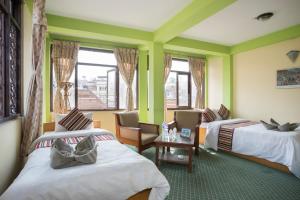 Ένα ή περισσότερα κρεβάτια σε δωμάτιο στο Hotel Yala Peak