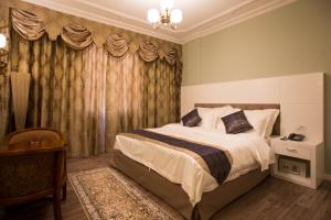 Postel nebo postele na pokoji v ubytování Hotel Britania