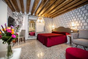 Posteľ alebo postele v izbe v ubytovaní Hotel Ca' Nobile Corner