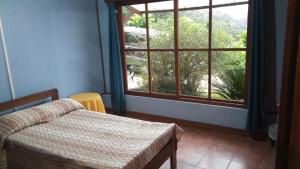 Lova arba lovos apgyvendinimo įstaigoje Finca Y Granja Loma Bonita