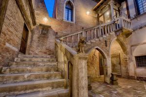 a staircase in an old building with a stair case at Hotel Ca' Nobile Corner in Venice