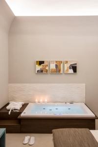 A bed or beds in a room at Villa Gervasio Rooms