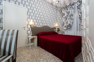 Posteľ alebo postele v izbe v ubytovaní Hotel Ca' Nobile Corner