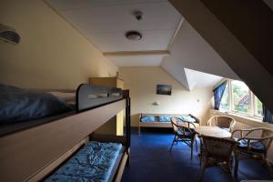 Säng eller sängar i ett rum på Hostel Herberg de Esborg Scheemda