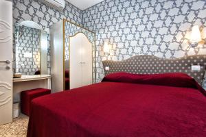 Posteľ alebo postele v izbe v ubytovaní Hotel Ca' Nobile Corner