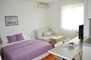 TV a/nebo společenská místnost v ubytování Apartmani Milin