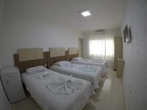 Postel nebo postele na pokoji v ubytování Hotel Dove + 22 fotografií