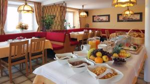 a table with food on it in a restaurant at Pension Busch in Salem