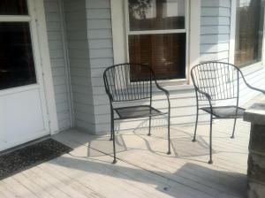 two chairs sitting on the porch of a house at Aunt Jane's Two in Put-in-Bay