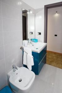 a bathroom with a sink and a toilet and a mirror at B&B Albergo Sicilia in Avola +55 photos
