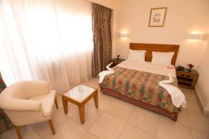 Postel nebo postele na pokoji v ubytování Hapi Hotel