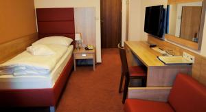 Łóżko lub łóżka w pokoju w obiekcie Hotel Club