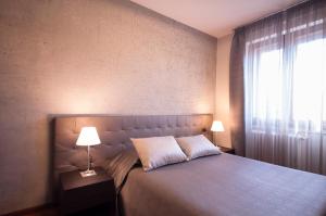 Voodi või voodid majutusasutuse Hotel Maloia toas