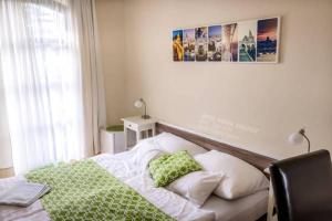 En eller flere senger på et rom på Hotel Bobbio