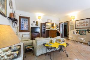 a living room with a couch and a table at B&B New Day in Assisi