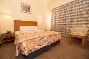 Postel nebo postele na pokoji v ubytování Hapi Hotel