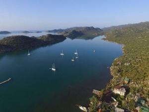 an aerial view of a large lake with boats in it at Cennet Pansiyon in Kaleucagız